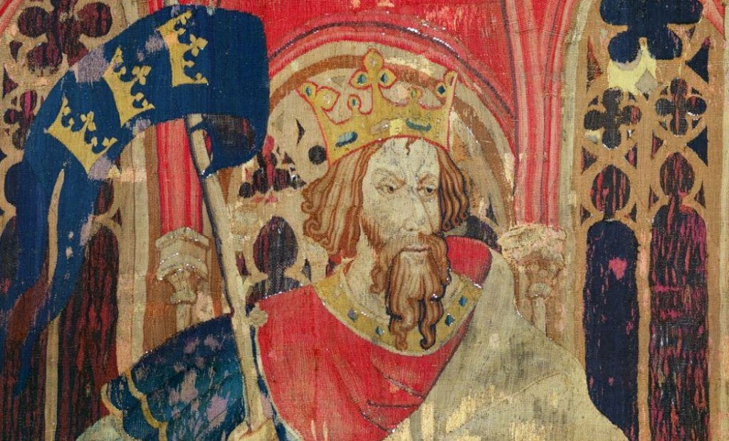Tapestry showing Arthur wearing a coat of arms often attributed to him. c. 1385
